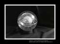 ENTITA' XI VI'98/ - combustione di tela dipinta con tecnica mista. Diametro nucleo sfera ceneri cm 8, diametro sfera esterna plexiglass cm 16