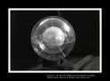 ENTITA' XX XI'99/I'00 - combustione di tela dipinta con anilina. Diametro nucleo sfera ceneri cm 14, diametro sfera esterna plexiglass cm 25